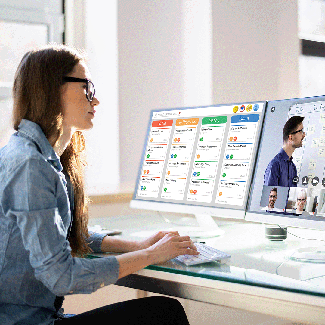 Lady working efficiently on a computer with Kanban Boards for NetSuite