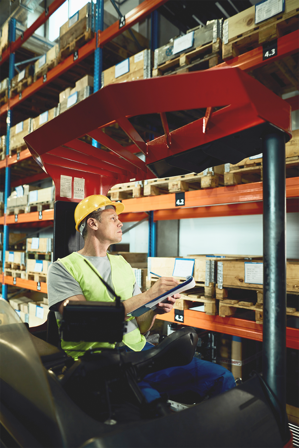 female in a warehouse scanning inventory in warehouse using CartonCloud for NetSuite